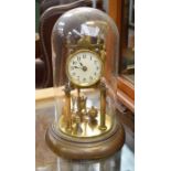 Early 20th century anniversary mantel clock with brass base and glass dome cover