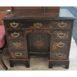 A lacquered 18th Century style Chinese export knee hole desk