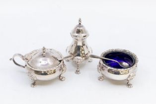 A Georgian style  silver cruet set comprising salt, pepper and mustard pot complete with spoon and