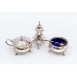 A Georgian style  silver cruet set comprising salt, pepper and mustard pot complete with spoon and