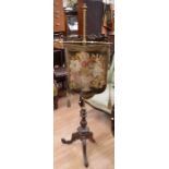 A Victorian brass fire pole screen, twist central brass support with cartouche shaped needlework