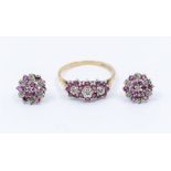 A ruby and diamond 9ct gold ring comprising three flower clusters set in a row, claw set with