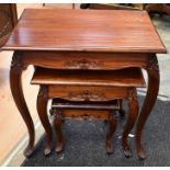 Nest of three mahogany tables in continental style