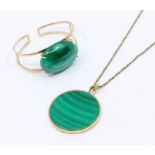 A malachite and 9ct gold mounted pendant, circular slice with a 9ct gold border, diameter approx