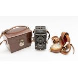 Roliflex camera and leather cased compass