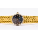 Baume Mercier: A  Ladies diamond set 18ct gold wristwatch, comprising a round blue tone dial with