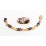 A Blue John and 9ct gold bracelet comprising alternate oval cut Blue John and gold Celtic pierced