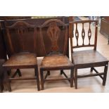 Three mid-18th century oak hall/bedroom chairs, one with damaged seat