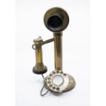 A vintage brass early 20th Century table top telephone