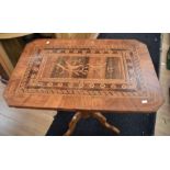 An Edwardian marquetry inlaid lounge table with bird detail to centre of top surface on marquetry
