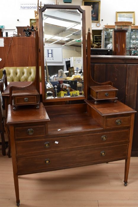 Two Edwardian mahogany dressing tables with mirrors, both on castors