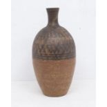 Studio pottery stoneware bottle vase with scratch decoration to top half. Height approx 32cm. Makers
