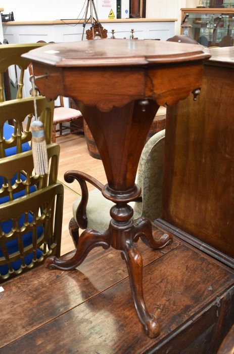 A Victorian mahogany pedestal sewing table