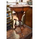 A Victorian mahogany pedestal sewing table