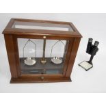 Griffin & Tatlock Ltd, a cased set of scales, with weights on a Bakelite stand, together with a