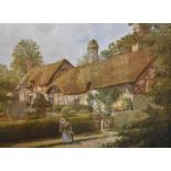 A large framed print of Anne Hathaway's Cottage