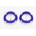 A pair of early 20th century silver and enamel buckles, oval form with blue guilloche enamel