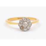A diamond and 22ct gold cut daisy cluster ring, set to the centre with a larger old cut diamond