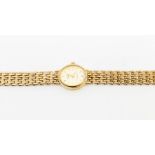 A ladies 9ct gold Rotary wristwatch, comprising an oval cream dial with applied baton hour