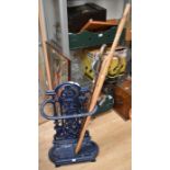 A late Victorian/Edwardian cast stick stand with drip tray and sticks
