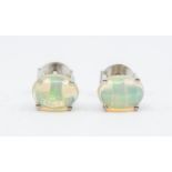 A pair of Ethiopian colourless opal and silver stud earrings, comprising oval opals approx 5 x