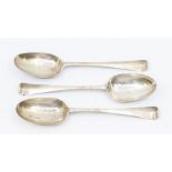 A set of three George III Irish silver Hanoverian table spoons, each reverse handle engraved with