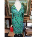 A PUCCI 1970's floral dress in silk jersey, different shades of green, the pattern is of interesting