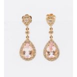 A pair of morganite and diamond set 18ct rose gold drop earrings, comprising a pear shaped grain set