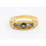 A sapphire and diamond 18ct gold boat head ring, comprising a graduated round cut sapphires and