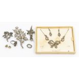 A collection of silver and marcasite jewellery including two brooches, a r9ing and pair of drop