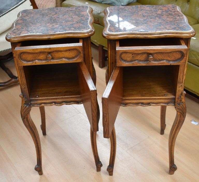 Pair of reproduction continental bedside cabinets with marble tops, a single drawer and a pot