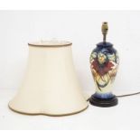 An Anna Lily lamp and shade by Moorcroft