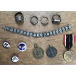 Collection of Reproduction German WW2 Badges, Rings, Medals and Bracelet.