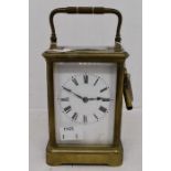 A brass cased carriage clock, striking on the hour with key