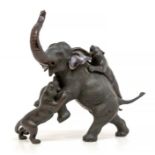 A large early 20th Century Japanese signed bronze of an elephant under attack by two tigers, nb