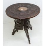 A Moorish table, carved with design, elephants head to base, bone inlay