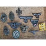 Collection of reproduction German uniform badges.