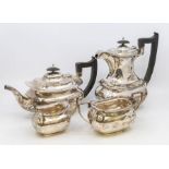 A George VI silver matched four piece tea service to include: teapot, hot water jug, sugar bowl