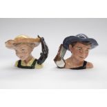 Two Royal Doulton character jugs: Tom Sawyer and Huckleberry Finn (with certificate). 11cm high.