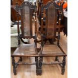 A pair of Jacobean style high back chairs, arched crest rails over cane back and seats (2)