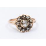 A diamond and rose gold flower cluster ring set throughout with rose cut diamonds, setting approx