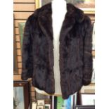 A ladies size 8 mink short fur coat in good clean condition