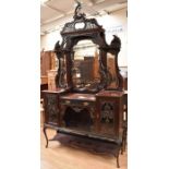 A late Victorian mahogany chiffonier, ornate cornice above with carved supports, having central