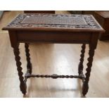 A late 19th / early 20th century mahogany hall table with a vine leaf carved detail on the top,