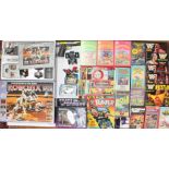 Collectables: A collection of assorted comics, VHS videos, WWF annuals, Robotix boxed set,