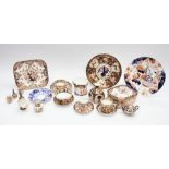 A collection of assorted Royal Crown Derby including; butter tub cover, stand, vases, cup and