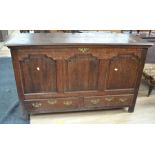 An early George III oak mule chest on block feet with a plain panelled front and sides, and two