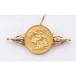 A Victoria sovereign dated 1885 mounted in a 9ct gold brooch mount, length approx 50mm, total