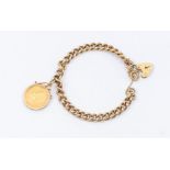 A 9ct gold Albert link bracelet with padlock clasp, suspending a George V full Sovereign dated 1911,