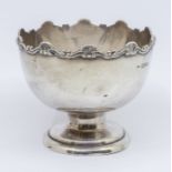 An Edwardian small monteith shaped  silver bon bon dish with shell and scroll rim, pedestal foot,